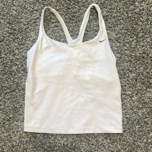 Nike size small tank top with built in bra. Light pink, hardly worn.